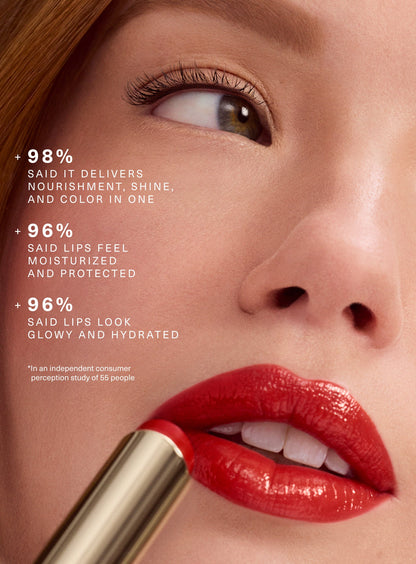 Model wearing Rare Beauty Soft Pinch Lip Oil Stick glossy color