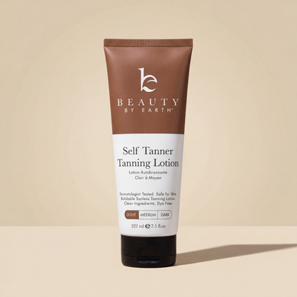 Beauty by Earth Self Tanner Body Lotion in Light, 7.5 fl oz tube on a beige background